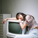 A teen girl sitting